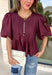 Elevate your everyday wardrobe with this beautifully detailed top from Entro. Designed in a rich merlot hue, this timeless blouse features elegant pleating throughout for added texture and a polished finish. Decorative front button details add classic charm, while the puff sleeves create a feminine silhouette that's easy to dress up or down. Crafted from a lightweight fabric blend, this versatile top is perfect for everything from workdays to weekend brunches and seasonal gatherings.