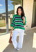 Classic with a fresh spring twist, this striped knit sweater by Entro is an easy piece to reach for on cooler spring days. Featuring a round neckline and ¾ length sleeves, it’s finished with subtle cable knit detailing that adds texture without feeling heavy. The green base is accented with black, blue, and white stripes, giving it a timeless look that pairs effortlessly with denim, trousers, or skirts.