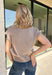Wrap yourself in everyday luxury with this irresistibly soft mocha cardigan. Crafted from an ultra-cozy knit blend with hints of silk and cashmere, this timeless layering piece feels just as good as it looks. The flattering v-neckline and classic button-front design make it easy to wear buttoned as a top or layered over your favorite tanks and dresses. 