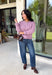 Wrap yourself in all the cozy vibes this season with this beautiful knit cardigan! Featuring gorgeous shades of purple woven throughout, this button-down cardigan is the perfect layering piece for crisp autumn mornings and cozy evenings. Front pockets add a practical touch, while the soft knit fabric makes it one you'll reach for again and again. Whether you're heading to brunch, the office, or enjoying a weekend at the pumpkin patch, this cardigan brings effortless comfort and style to every outfit.