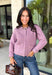 Wrap yourself in all the cozy vibes this season with this beautiful knit cardigan! Featuring gorgeous shades of purple woven throughout, this button-down cardigan is the perfect layering piece for crisp autumn mornings and cozy evenings. Front pockets add a practical touch, while the soft knit fabric makes it one you'll reach for again and again. Whether you're heading to brunch, the office, or enjoying a weekend at the pumpkin patch, this cardigan brings effortless comfort and style to every outfit.