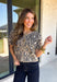 Classic leopard print gets a feminine update in this irresistibly cozy cardigan. Designed with a timeless leopard pattern, this soft sweater knit features charming puff sleeves and a classic button-front silhouette that's as versatile as it is stylish. Wear it buttoned as a top or layered over your favorite tank or tee for endless outfit possibilities. 