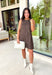 Timeless prints never go out of style, and this charming sleeveless dress is proof. Designed in a rich brown hue with a classic off-white polka dot print, this easy-to-wear dress brings effortless style to every fall occasion. The relaxed silhouette is both flattering and comfortable, while the front pockets add a practical touch you'll love. Finished with a delicate keyhole button closure at the back, this versatile dress can easily be dressed up or down.