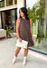 Timeless prints never go out of style, and this charming sleeveless dress is proof. Designed in a rich brown hue with a classic off-white polka dot print, this easy-to-wear dress brings effortless style to every fall occasion. The relaxed silhouette is both flattering and comfortable, while the front pockets add a practical touch you'll love. Finished with a delicate keyhole button closure at the back, this versatile dress can easily be dressed up or down.