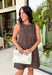 Timeless prints never go out of style, and this charming sleeveless dress is proof. Designed in a rich brown hue with a classic off-white polka dot print, this easy-to-wear dress brings effortless style to every fall occasion. The relaxed silhouette is both flattering and comfortable, while the front pockets add a practical touch you'll love. Finished with a delicate keyhole button closure at the back, this versatile dress can easily be dressed up or down.