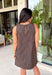 Timeless prints never go out of style, and this charming sleeveless dress is proof. Designed in a rich brown hue with a classic off-white polka dot print, this easy-to-wear dress brings effortless style to every fall occasion. The relaxed silhouette is both flattering and comfortable, while the front pockets add a practical touch you'll love. Finished with a delicate keyhole button closure at the back, this versatile dress can easily be dressed up or down.