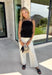 Every fall wardrobe needs a classic black cami, and this one is anything but basic! Designed with chic vertical pleating along the bodice, it adds beautiful texture and an elevated touch to any outfit. The adjustable shoulder straps and smocked back panel provide a comfortable, flattering fit, making it just as easy to wear on its own as it is layered under blazers, cardigans, or jackets. 