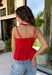 Every fall wardrobe needs a classic red cami, and this one is anything but basic! Designed with chic vertical pleating along the bodice, it adds beautiful texture and an elevated touch to any outfit. The adjustable shoulder straps and smocked back panel provide a comfortable, flattering fit, making it just as easy to wear on its own as it is layered under blazers, cardigans, or jackets. 