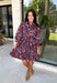 Celebrate the beauty of fall in this effortlessly chic dress from Entro. Designed with a rich brown backdrop and a beautiful floral and leaf print in autumn shades, this timeless dress is full of charming details. The classic shirt collar and button-front closure create a polished look, while the self-tie belt and elastic back waist provide a flattering, comfortable fit. Finished with ¾ balloon sleeves, a feminine tiered hem, convenient side pockets, and a fully lined design.