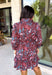 Celebrate the beauty of fall in this effortlessly chic dress from Entro. Designed with a rich brown backdrop and a beautiful floral and leaf print in autumn shades, this timeless dress is full of charming details. The classic shirt collar and button-front closure create a polished look, while the self-tie belt and elastic back waist provide a flattering, comfortable fit. Finished with ¾ balloon sleeves, a feminine tiered hem, convenient side pockets, and a fully lined design.