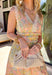 This light pink and light yellow sleeveless midi dress is giving sunshine, and spring getaways all in one! The colorful paisley print adds the prettiest mix of detail, while the cream lace trim throughout gives it that soft, boho-inspired finish we can’t get enough of. The flattering elastic waist creates shape without sacrificing comfort, and the ladder hem detailing adds texture and movement to every step.