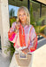 This colorful stripe button down top is bringing all the sunset-inspired summer vibes! With shades of pink and coral, it adds the prettiest pop of color while still feeling soft and easy to style. Lightweight and breathable, it’s perfect for layering over a tank or wearing on its own for an effortless, put-together look. The classic button down design keeps it timeless, while the vibrant stripes make it stand out. 
