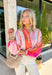 This colorful stripe button down top is bringing all the sunset-inspired summer vibes! With shades of pink and coral, it adds the prettiest pop of color while still feeling soft and easy to style. Lightweight and breathable, it’s perfect for layering over a tank or wearing on its own for an effortless, put-together look. The classic button down design keeps it timeless, while the vibrant stripes make it stand out. 
