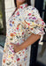 Bring a touch of color to your fall wardrobe with this effortlessly charming botanical dress. Featuring a neutral backdrop with a vibrant floral print, this feminine dress is perfect for everything from brunch dates to fall festivals. The adjustable drawstring waist creates a flattering silhouette, while the collared v-neckline and partial button placket add a timeless touch. Finished with sweet tie details at the sleeves, side pockets, and a fully lined design.
