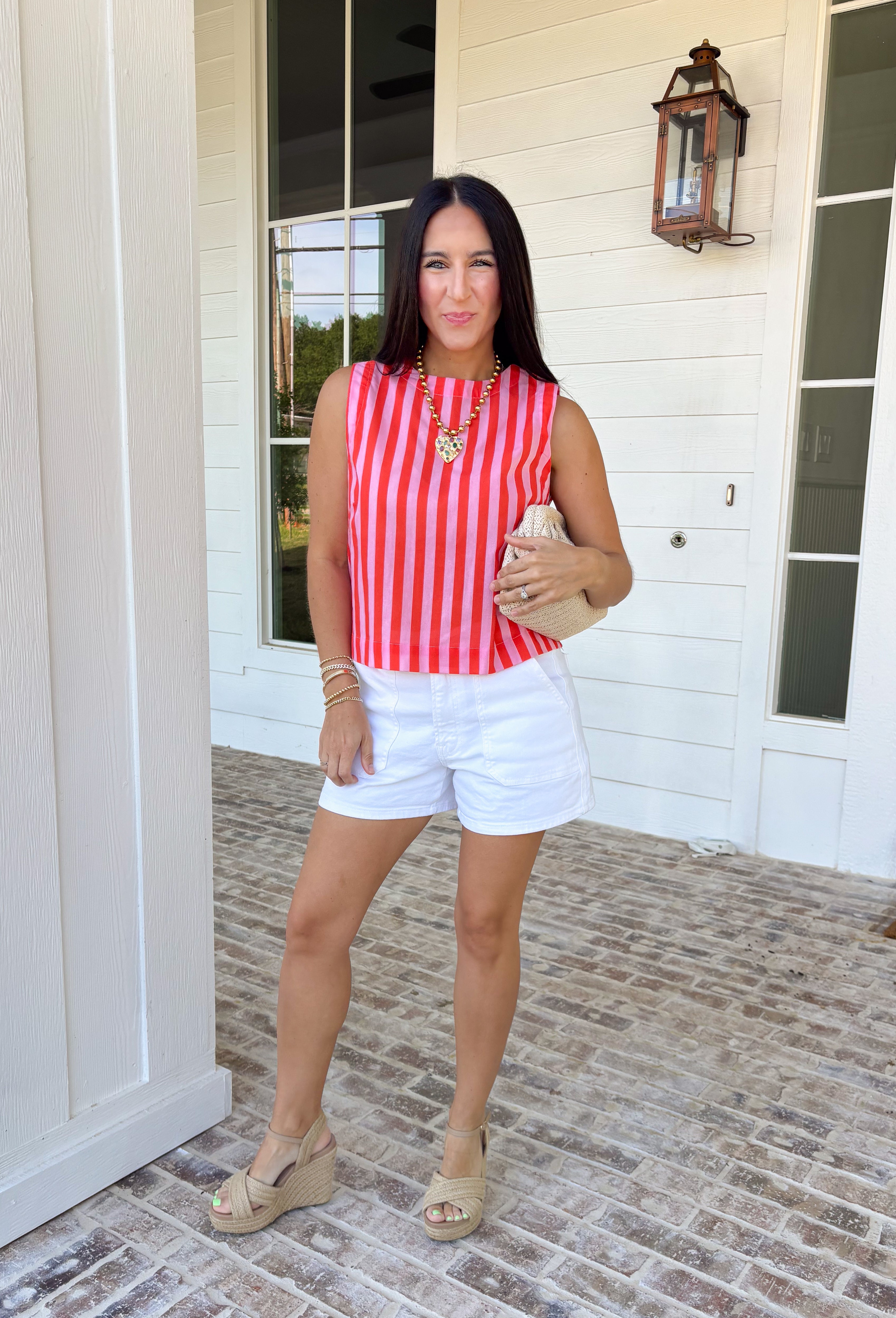 Easy, breezy, and made for sunny days—this red and pink striped tank is the kind of spring staple you’ll reach for on repeat. It’s lightweight, comfy, and effortlessly cute with a classic stripe that never goes out of style. The keyhole closure in the back adds a fun little detail that makes it feel extra special while still keeping it totally everyday-wearable.