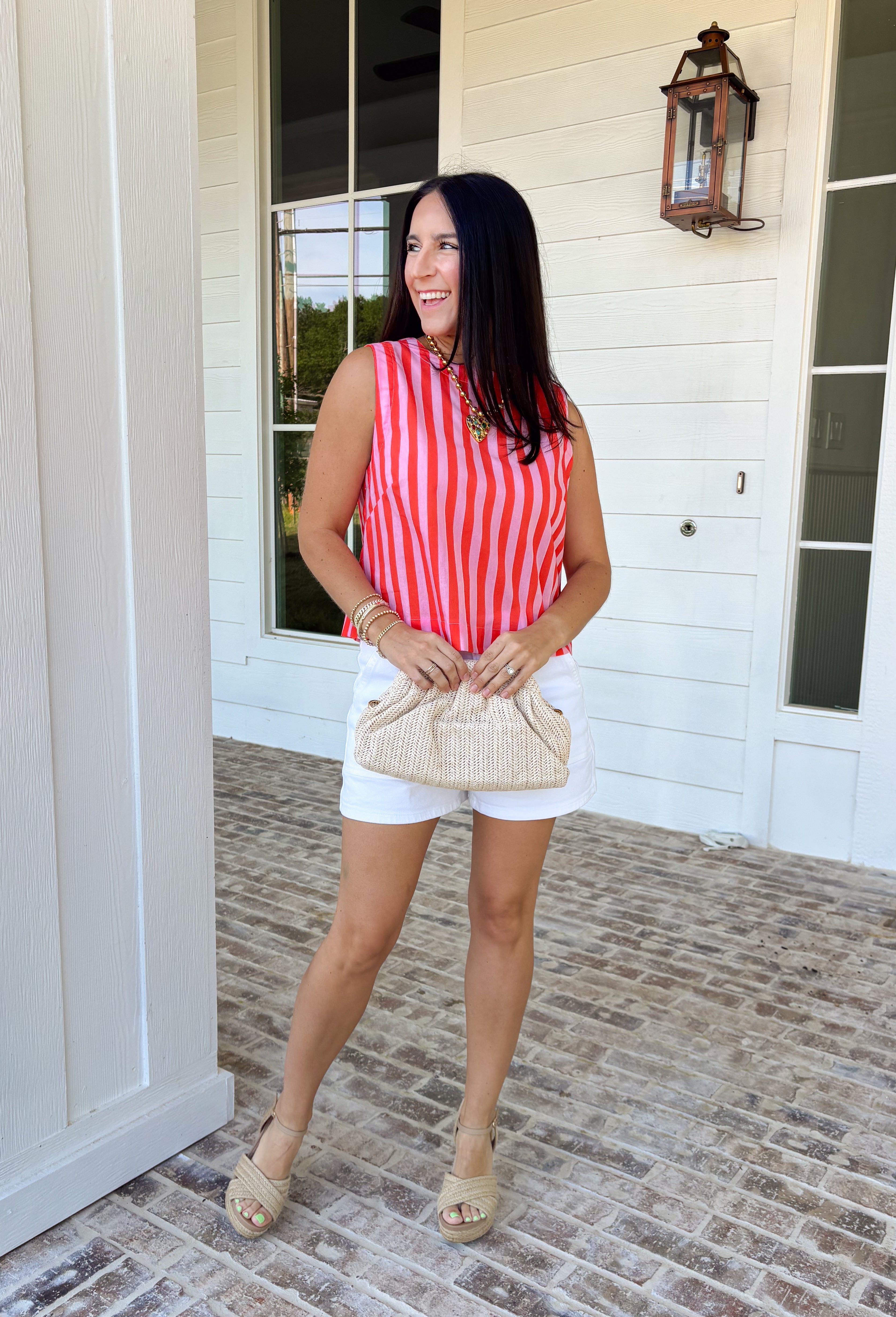 Easy, breezy, and made for sunny days—this red and pink striped tank is the kind of spring staple you’ll reach for on repeat. It’s lightweight, comfy, and effortlessly cute with a classic stripe that never goes out of style. The keyhole closure in the back adds a fun little detail that makes it feel extra special while still keeping it totally everyday-wearable.