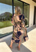 All the colors we love for fall come together in this printed midi dress from Entro. A mix of olive, navy, and tan creates a rich seasonal palette that feels right at home at autumn gatherings, family photos, and weekend plans. The v-neckline is accented with contrast stripe trim for a fun mix of prints, while long balloon sleeves add beautiful shape to the silhouette. A coordinating self-tie belt lets you define the waist, and convenient side pockets make it even easier to wear. 