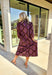 Earthy tones meet feminine charm in this beautiful botanical print midi dress by Entro. Designed with ¾ sleeves and a soft ruffle trim along the collar and front placket, it’s full of subtle details that make it feel special. The button-front design and side pockets bring functionality, while the brown base with purple and dark yellow florals gives it that perfect fall color palette. Fully lined and made from breathable cotton, it’s comfortable enough for all-day wear while keeping your look effortlessly po