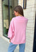 Add a little western attitude to your cozy season! This playful pink mock neck sweatshirt features a bold "Cool It, Cowboy" graphic in textured green striped lettering for the perfect mix of retro charm and everyday comfort. The ribbed neckline, cuffs, and hem give this fleece-lined pullover an elevated finish, making it a standout piece you'll love wearing on crisp fall days.