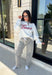 Show your Texas pride in the coziest way possible! This ash grey mock neck sweatshirt blends everyday comfort with timeless style, featuring "Texas" in soft script across the chest and a sweet heart detail on the sleeve. The fleece-lined interior keeps you warm and cozy, while the classic silhouette makes it an easy favorite for everything from football Saturdays and coffee runs to relaxed weekends at home. 
