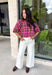 Add a cozy pop of pattern to your everyday wardrobe with this charming sweater from Entro. Designed in a pink and brown plaid knit, this short sleeve sweater is the perfect blend of classic style and seasonal warmth. The soft, cozy knit makes it comfortable enough for all-day wear, while the timeless plaid pattern adds effortless charm to any outfit. 