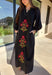 Bring elegance to the winter season with this stunning black embroidered midi dress by Entro. Featuring beautiful burgundy and olive floral embroidery, this long sleeve dress combines cozy sophistication with timeless charm. The contrast trim v-neck and subtle side slits add a touch of movement, while the fully lined design ensures comfort and warmth. Perfect for winter gatherings, holiday dinners, or date nights, this dress is effortlessly refined for the season.