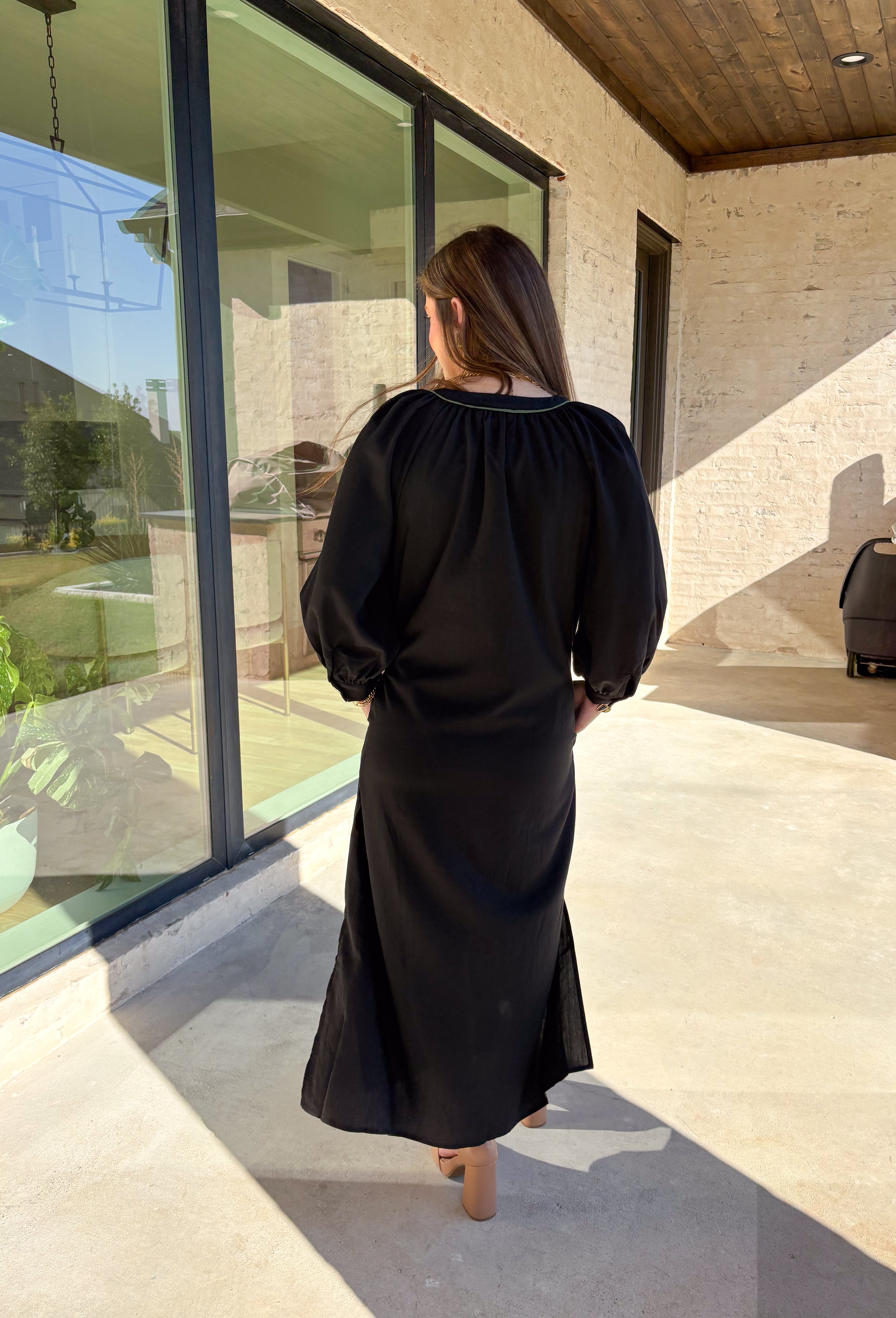 Bring elegance to the winter season with this stunning black embroidered midi dress by Entro. Featuring beautiful burgundy and olive floral embroidery, this long sleeve dress combines cozy sophistication with timeless charm. The contrast trim v-neck and subtle side slits add a touch of movement, while the fully lined design ensures comfort and warmth. Perfect for winter gatherings, holiday dinners, or date nights, this dress is effortlessly refined for the season.