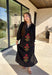 Bring elegance to the winter season with this stunning black embroidered midi dress by Entro. Featuring beautiful burgundy and olive floral embroidery, this long sleeve dress combines cozy sophistication with timeless charm. The contrast trim v-neck and subtle side slits add a touch of movement, while the fully lined design ensures comfort and warmth. Perfect for winter gatherings, holiday dinners, or date nights, this dress is effortlessly refined for the season.