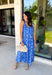 Feminine, fresh, and perfect for sunny days! This sleeveless blue midi dress features a beautiful floral print that feels soft and romantic. Darker blue trim paneling throughout adds a lovely contrast that highlights the silhouette and gives the dress a little extra detail. Smocking along the back and on the back straps creates a comfortable, flexible fit while keeping the shape flattering. 