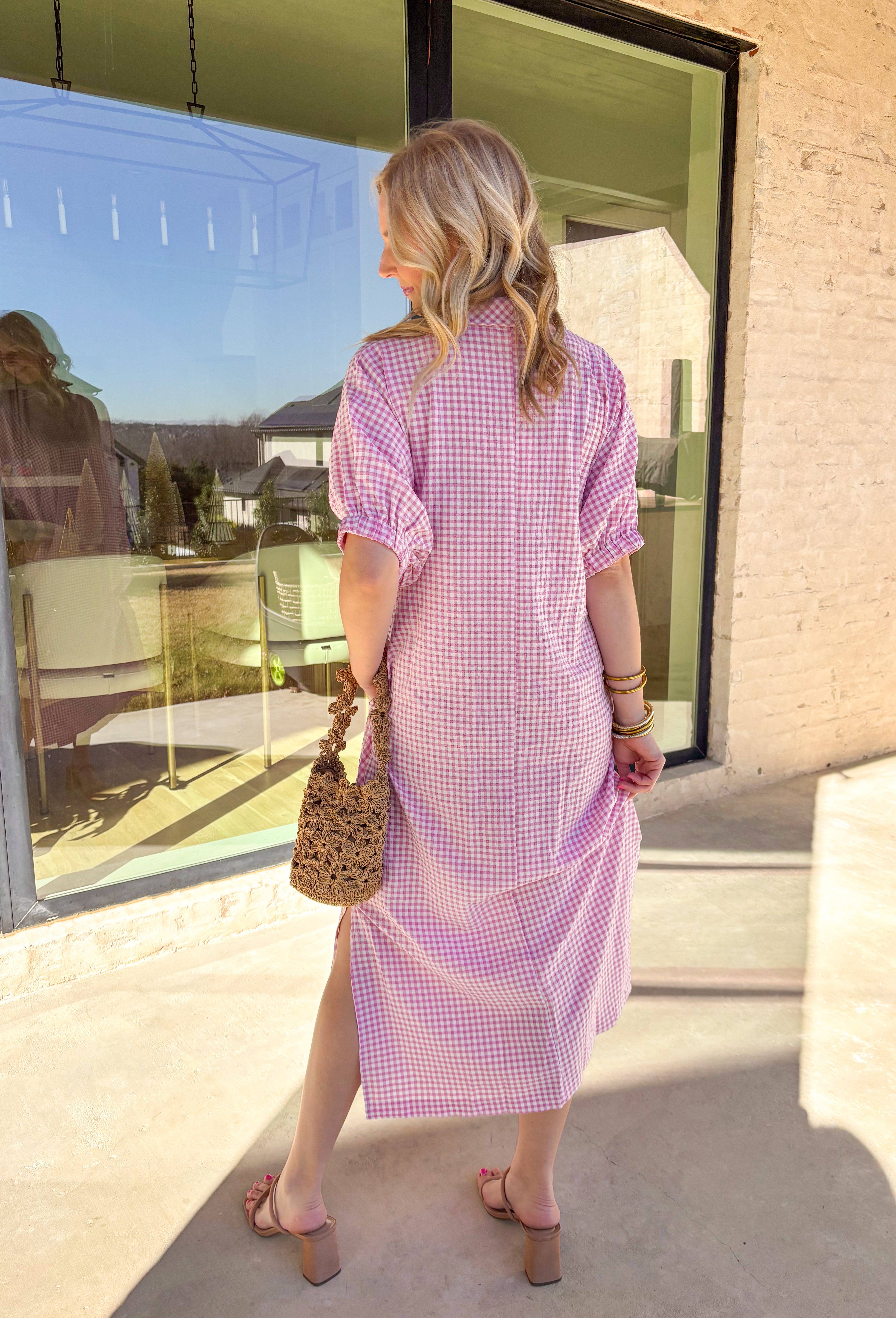 Sweet, classic, and perfect for spring days, this pink and white mini gingham midi dress is an effortless favorite. The timeless gingham print feels fresh and cheerful, while the collared neckline adds a polished touch. Elastic short sleeves keep it comfortable and easy to wear, and side pockets make it as practical as it is cute. With a flattering midi length and lightweight feel, this dress is ready for everything from brunch to casual spring outings.