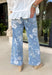 These light wash floral flare jeans are giving major retro summer energy in the best way! Designed with a super high-rise fit and an extreme vintage flare leg, they instantly elongate your silhouette while making a statement. The muted floral print adds a soft, feminine touch that feels unique but still easy to style for everyday wear. Pair them with a simple tank, graphic tee, or lightweight blouse and let the jeans do all the talking. 