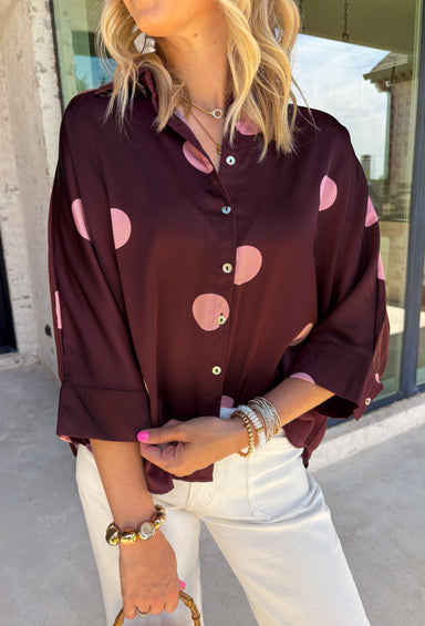 A classic polka dot blouse is a must-have for every fall wardrobe. Timeless and effortlessly polished, this collared top is designed with an easy silhouette that transitions seamlessly from the office to weekend outings. The button front, 3/4-length sleeves with button cuffs, and back pleat detail add elevated touches you'll appreciate, while the lightweight fabric keeps it comfortable all day long. Pair it with your favorite denim or tailored trousers for a look that never goes out of style.