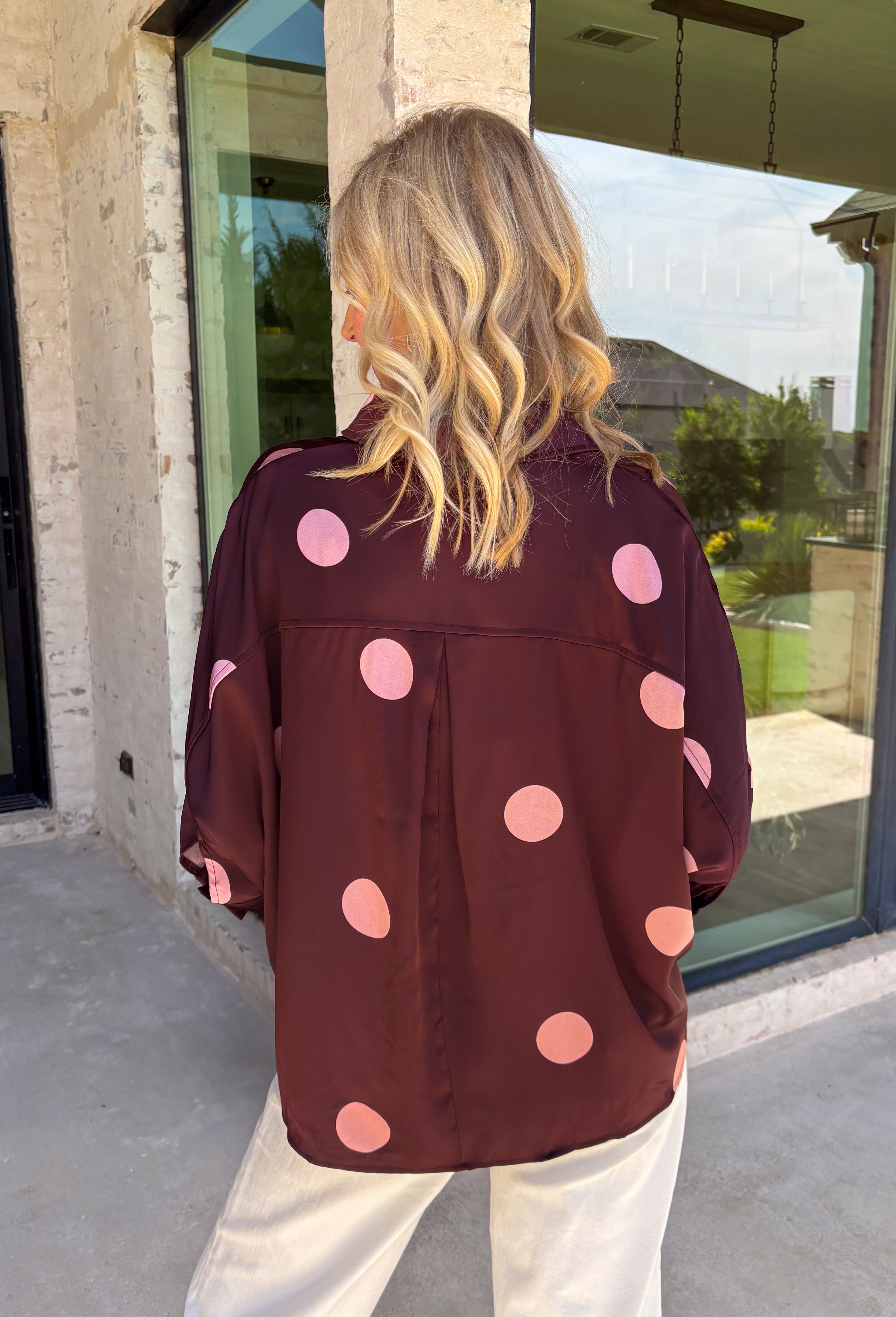 A classic polka dot blouse is a must-have for every fall wardrobe. Timeless and effortlessly polished, this collared top is designed with an easy silhouette that transitions seamlessly from the office to weekend outings. The button front, 3/4-length sleeves with button cuffs, and back pleat detail add elevated touches you'll appreciate, while the lightweight fabric keeps it comfortable all day long. Pair it with your favorite denim or tailored trousers for a look that never goes out of style.