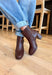 The Chinese Laundry Dodger Smoosh Brown Boots combine classic style with everyday comfort. Crafted in a versatile brown shade, these boots feature a sleek silhouette designed to complement a wide range of outfits. Their cushioned insoles provide lasting support, making them ideal for all-day wear. Durable construction ensures these boots maintain their shape and finish, while the textured sole enhances traction for stability. Perfect for both casual and dressier occasions, they offer a refined look with dep