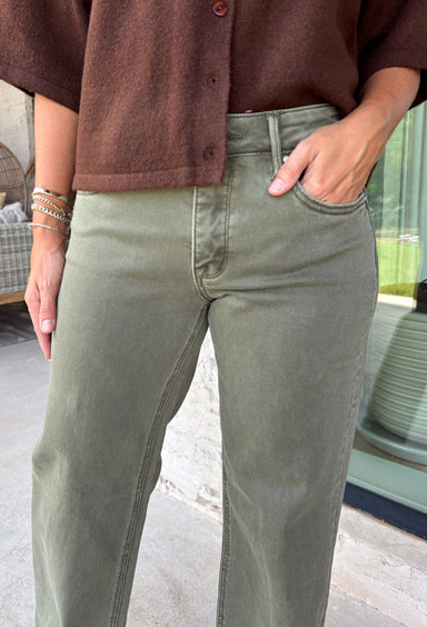 Refresh your denim collection with these effortlessly flattering straight leg jeans from Risen. Designed in a versatile olive hue, these mid-rise jeans feature Risen's signature tummy control panel for a smooth, confidence-boosting fit you'll love. The classic straight leg silhouette offers timeless style, while the raw edge hem adds a modern touch. Crafted with just the right amount of stretch for all-day comfort, these jeans are an easy staple you'll reach for season after season.