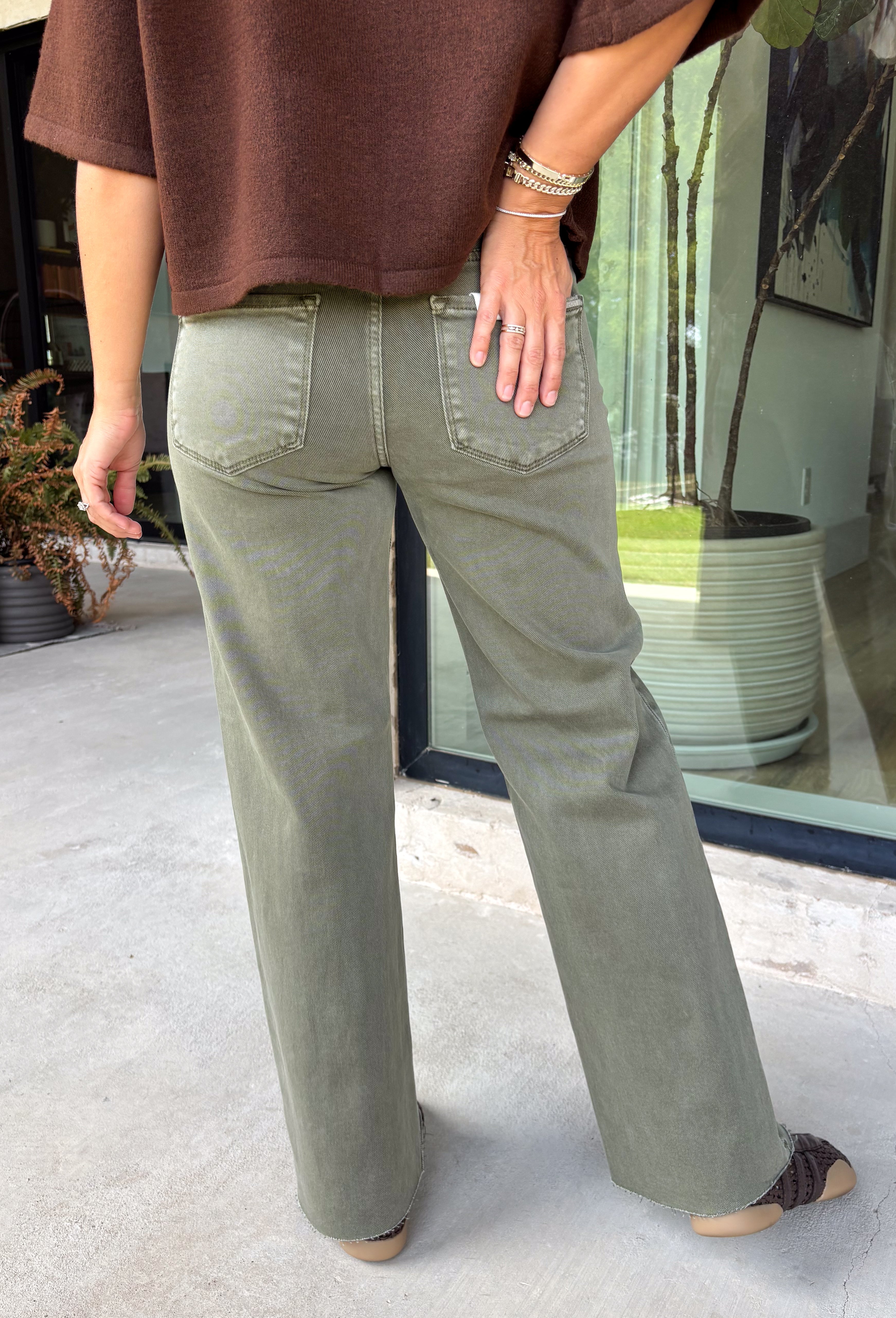 Refresh your denim collection with these effortlessly flattering straight leg jeans from Risen. Designed in a versatile olive hue, these mid-rise jeans feature Risen's signature tummy control panel for a smooth, confidence-boosting fit you'll love. The classic straight leg silhouette offers timeless style, while the raw edge hem adds a modern touch. Crafted with just the right amount of stretch for all-day comfort, these jeans are an easy staple you'll reach for season after season.