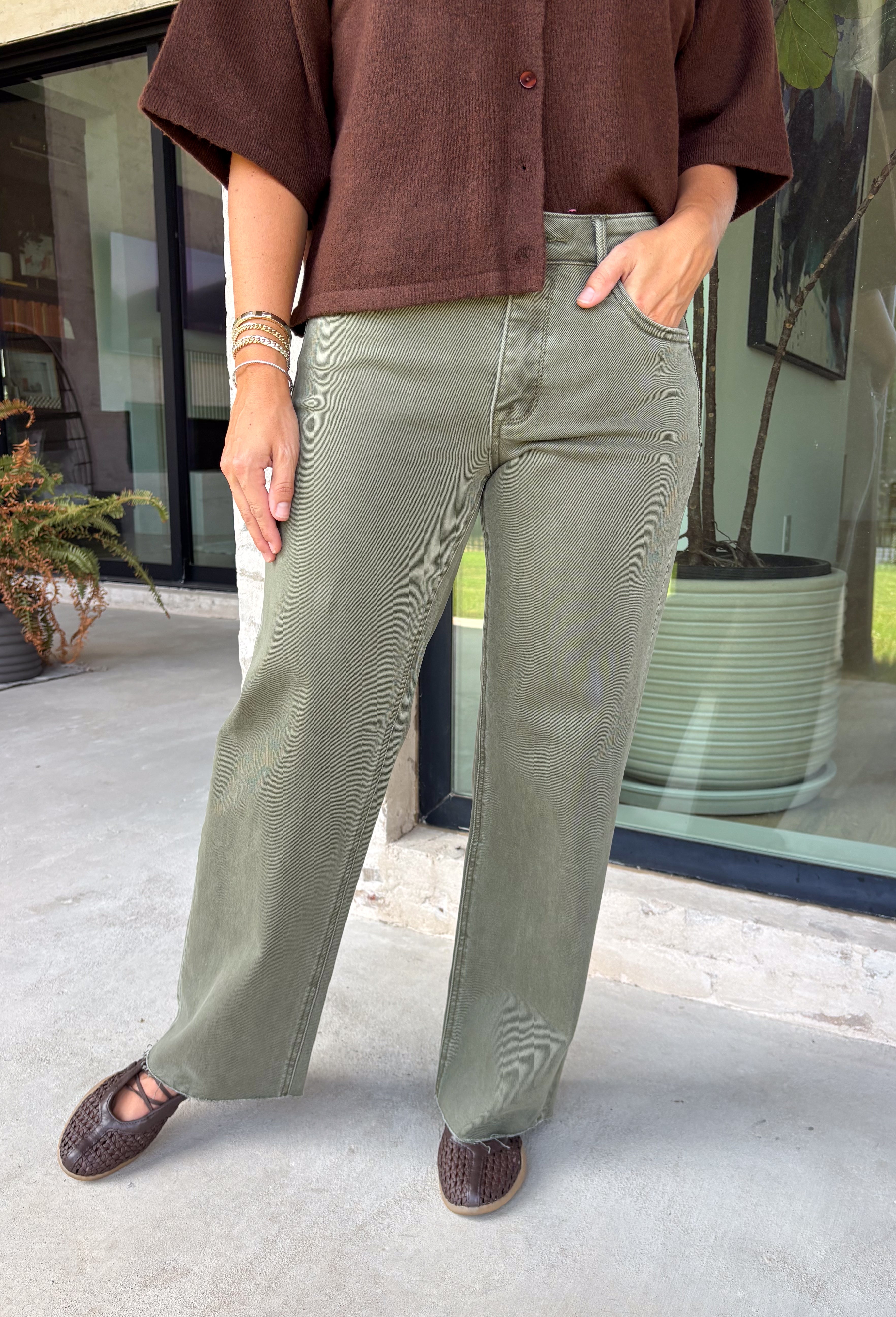 Refresh your denim collection with these effortlessly flattering straight leg jeans from Risen. Designed in a versatile olive hue, these mid-rise jeans feature Risen's signature tummy control panel for a smooth, confidence-boosting fit you'll love. The classic straight leg silhouette offers timeless style, while the raw edge hem adds a modern touch. Crafted with just the right amount of stretch for all-day comfort, these jeans are an easy staple you'll reach for season after season.