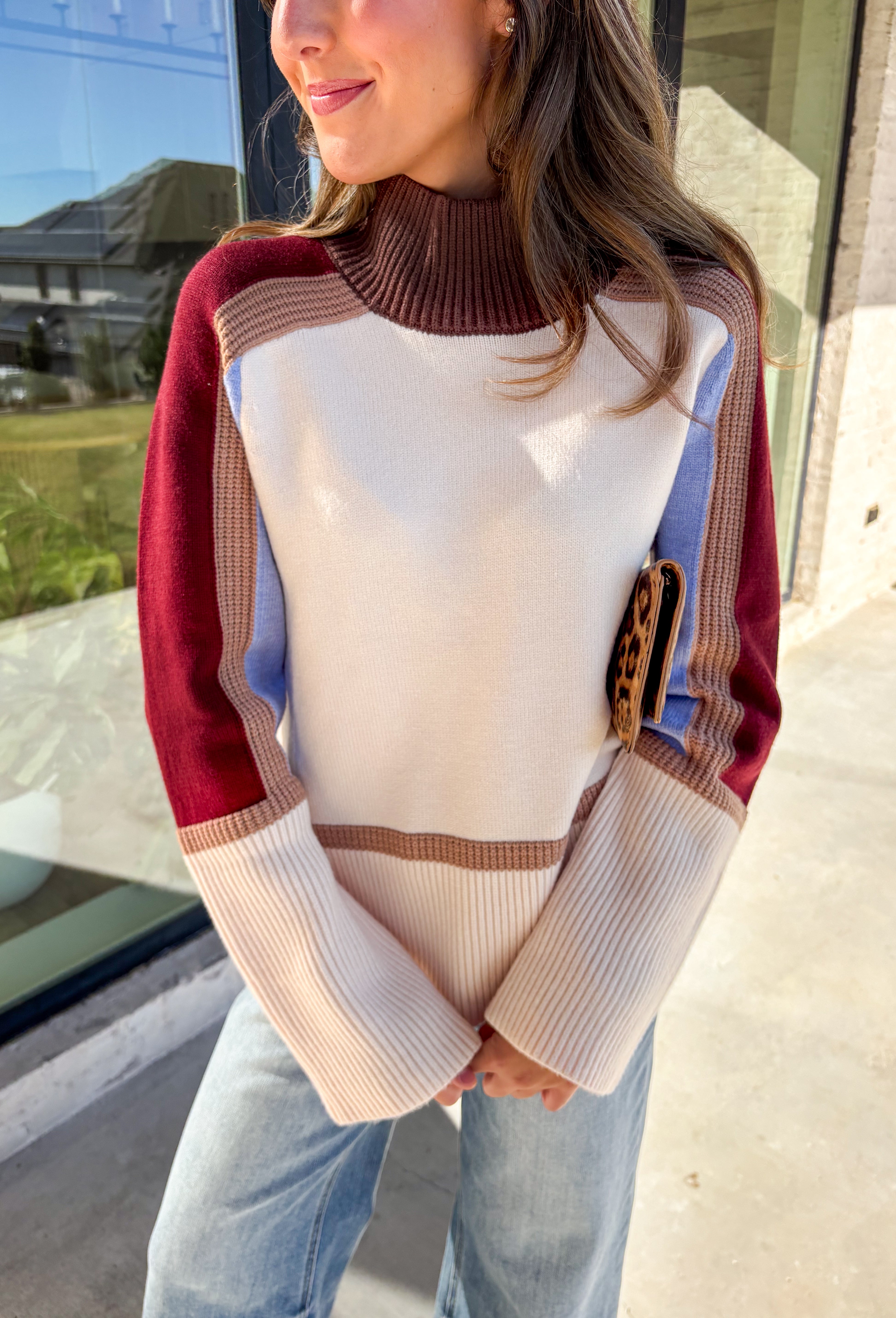 This neutral mock neck sweater by THML is the perfect mix of cozy comfort and colorful charm. With soft details in brown, tan, burgundy, and blue woven throughout, it adds just the right pop of pattern to your fall wardrobe. The mock neckline and relaxed fit make it easy to style for chilly days—whether you’re heading to brunch, a football game, or a cozy night in.