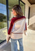 This neutral mock neck sweater by THML is the perfect mix of cozy comfort and colorful charm. With soft details in brown, tan, burgundy, and blue woven throughout, it adds just the right pop of pattern to your fall wardrobe. The mock neckline and relaxed fit make it easy to style for chilly days—whether you’re heading to brunch, a football game, or a cozy night in.