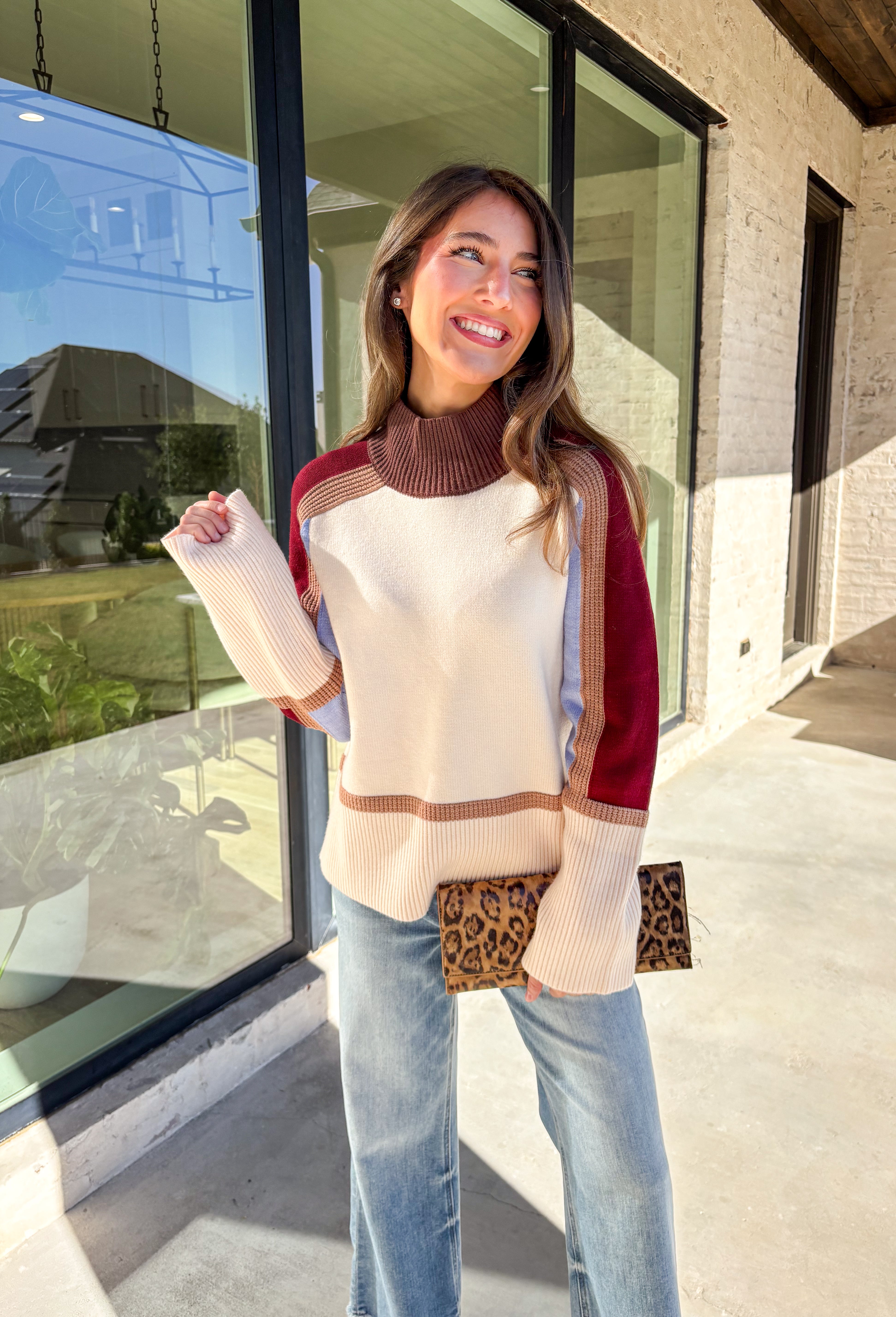 This neutral mock neck sweater by THML is the perfect mix of cozy comfort and colorful charm. With soft details in brown, tan, burgundy, and blue woven throughout, it adds just the right pop of pattern to your fall wardrobe. The mock neckline and relaxed fit make it easy to style for chilly days—whether you’re heading to brunch, a football game, or a cozy night in.