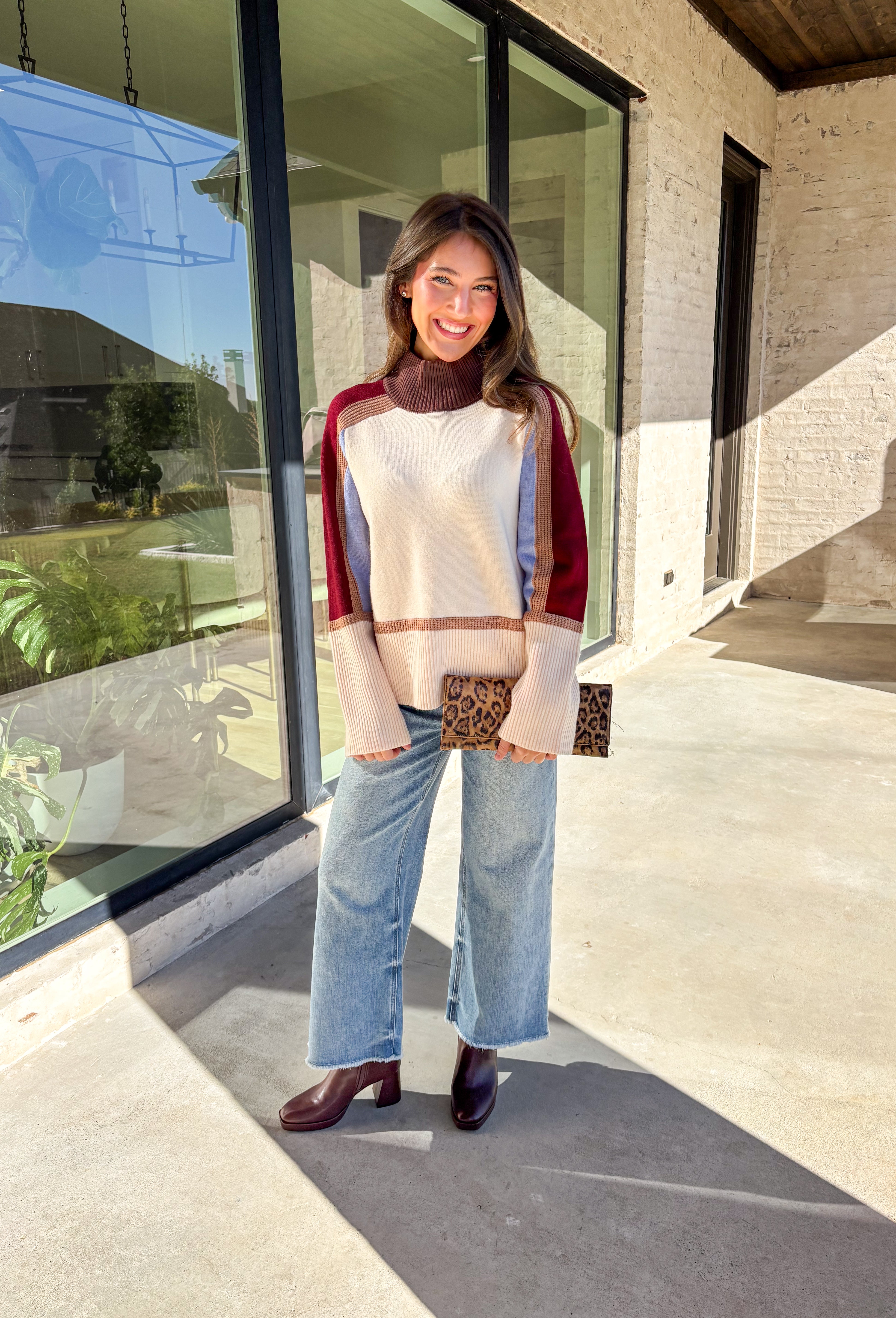 This neutral mock neck sweater by THML is the perfect mix of cozy comfort and colorful charm. With soft details in brown, tan, burgundy, and blue woven throughout, it adds just the right pop of pattern to your fall wardrobe. The mock neckline and relaxed fit make it easy to style for chilly days—whether you’re heading to brunch, a football game, or a cozy night in.