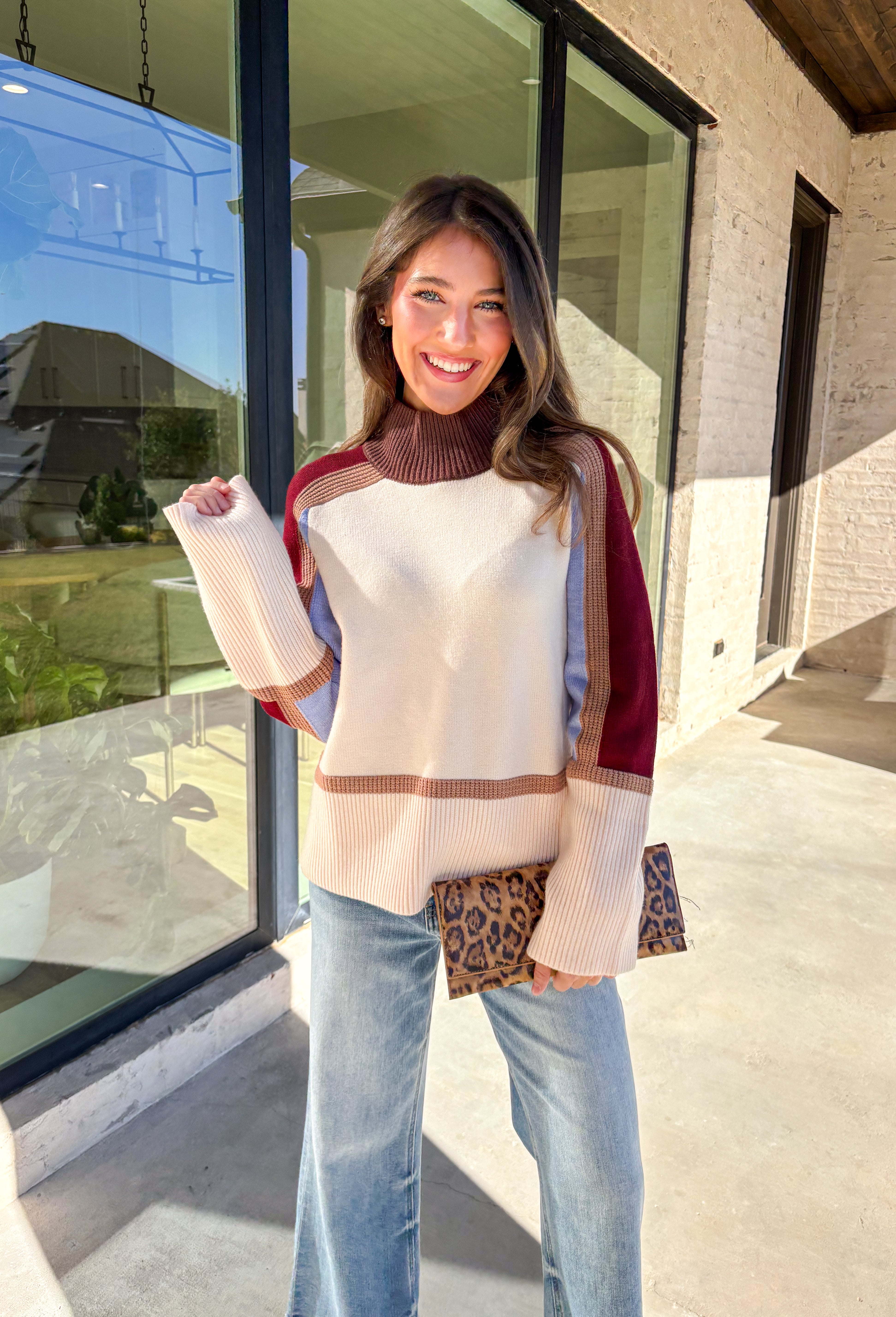 This neutral mock neck sweater by THML is the perfect mix of cozy comfort and colorful charm. With soft details in brown, tan, burgundy, and blue woven throughout, it adds just the right pop of pattern to your fall wardrobe. The mock neckline and relaxed fit make it easy to style for chilly days—whether you’re heading to brunch, a football game, or a cozy night in.