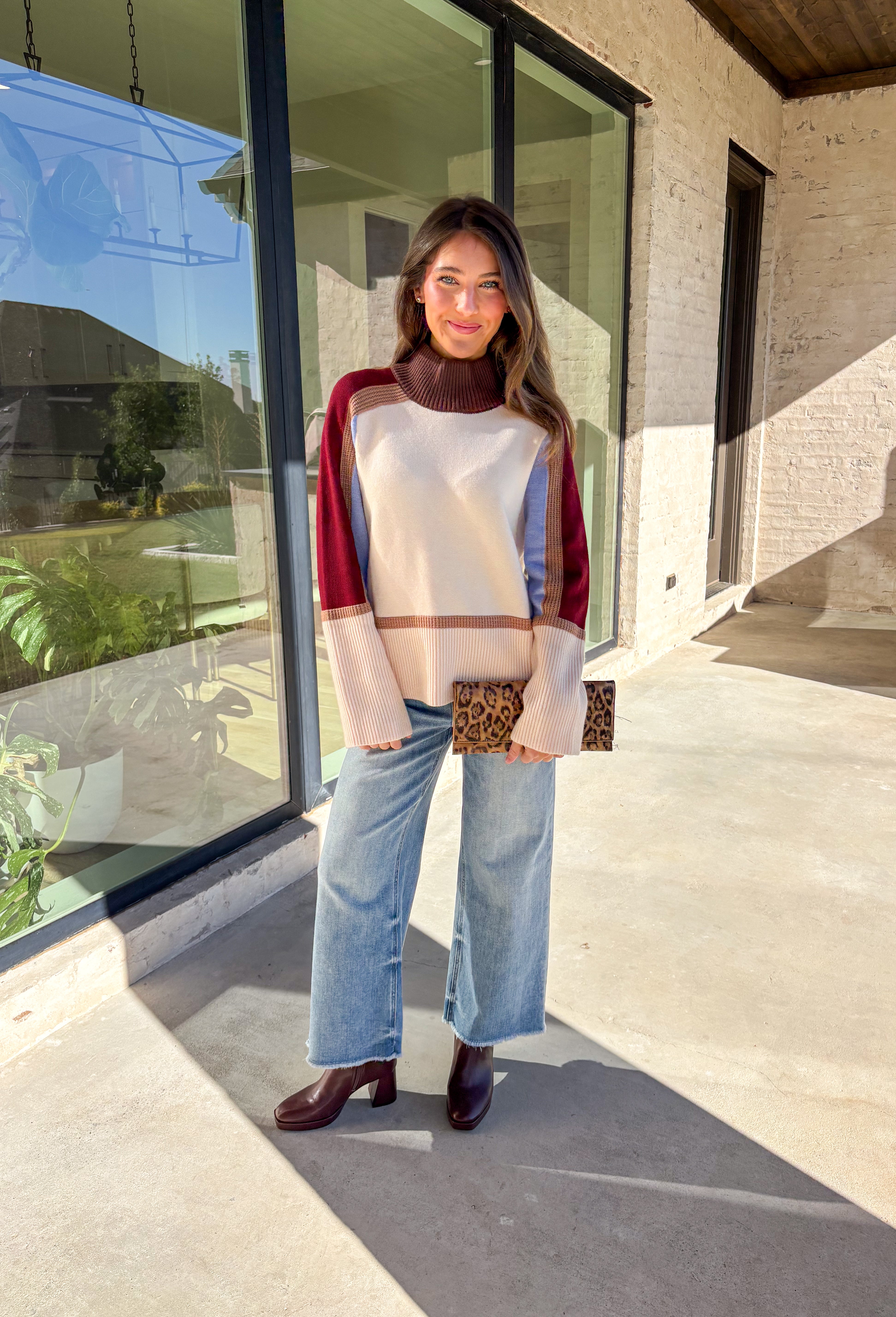 This neutral mock neck sweater by THML is the perfect mix of cozy comfort and colorful charm. With soft details in brown, tan, burgundy, and blue woven throughout, it adds just the right pop of pattern to your fall wardrobe. The mock neckline and relaxed fit make it easy to style for chilly days—whether you’re heading to brunch, a football game, or a cozy night in.