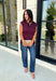Rich seasonal color meets effortless style in this beautiful burgundy sleeveless top. Designed with flattering pleated waist detailing, this timeless piece creates a polished silhouette that's easy to dress up or down. The soft knit fabric offers all-day comfort, making it perfect for layering under blazers and jackets throughout the fall or wearing on its own during warmer autumn afternoons. 