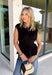 Every wardrobe needs a timeless black top, and this one checks every box! Designed with flattering pleated waist detailing, this sleeveless top creates a polished silhouette that's easy to dress up or down. The soft knit fabric offers all-day comfort, making it perfect for layering under blazers and jackets during the fall or wearing on its own while the weather is still warm. From the office to dinner dates and weekend outings, this versatile piece is one you'll reach for season after season.
