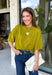 A rich olive green gets a pretty update with this pearl-detailed short sleeve sweater from Glam. Pearl detailing throughout adds a special touch to the soft knit, making it easy to dress up while still keeping that cozy, everyday feel. Exposed hems bring in a relaxed finish, while ribbed detailing along the neckline, sleeve cuffs, and hem gives it a classic sweater look. Wear it to the office, dinner plans, or anytime your outfit could use a little something extra.