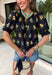 A little bold, a little bright, and totally spring-ready—this black short sleeve top by Entro is the perfect mix of classic and colorful. Featuring a patch floral embroidered print on the front with pops of green, blue, pink, and yellow, it adds beautiful texture and a fun burst of color against the solid black base. The back stays solid black for a clean contrast, and a keyhole closure adds a sweet finishing touch. 