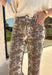 Make a statement with these effortlessly stylish cropped wide leg pants from Entro. Designed in an eye-catching ecru and brown snake print, these versatile pants bring the perfect mix of bold style and everyday comfort. The flattering wide leg silhouette and cropped length create a modern look that's easy to dress up or down, while the classic zip-fly button closure and functional pockets make them as practical as they are chic.