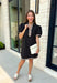 Classic with a modern twist, this black dress is the definition of effortless fall style. Classic black is beautifully accented with tan and cream trim along the front, sides, hem, and sleeves for a look that feels both timeless and eye-catching. The front button details and soft puff sleeves add just the right amount of charm, while the fully lined design and side pockets make it as comfortable as it is stylish. 