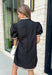 Classic with a modern twist, this black dress is the definition of effortless fall style. Classic black is beautifully accented with tan and cream trim along the front, sides, hem, and sleeves for a look that feels both timeless and eye-catching. The front button details and soft puff sleeves add just the right amount of charm, while the fully lined design and side pockets make it as comfortable as it is stylish. 